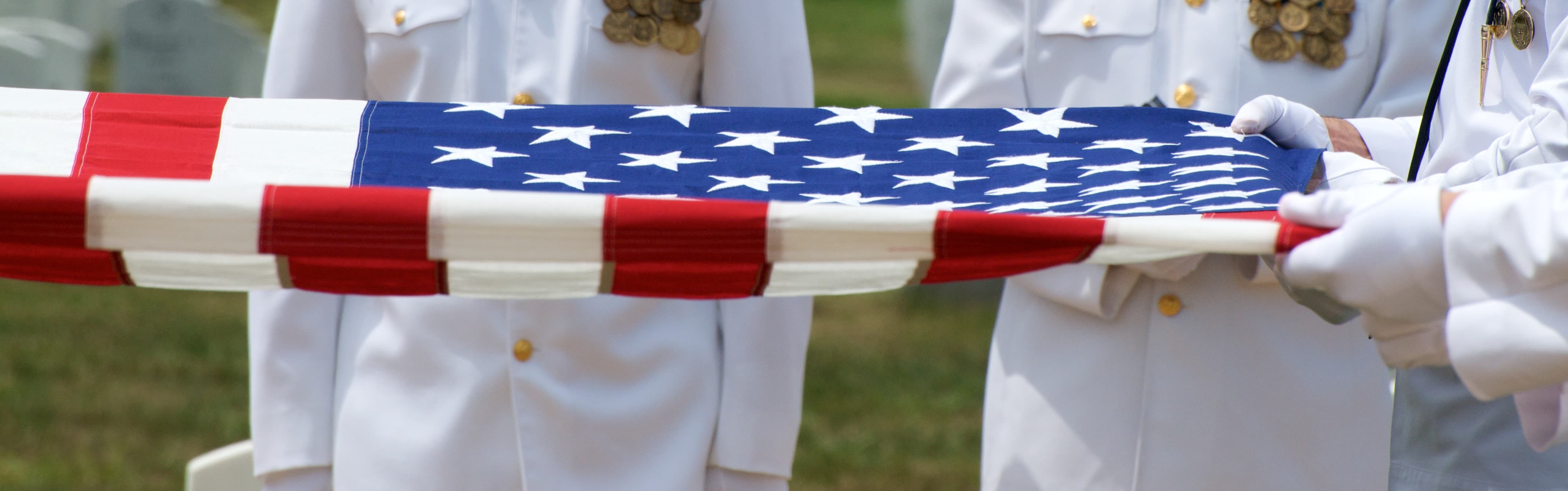 American flag being held at a memorial at Arlington Cemetery in Arlington, Virginia